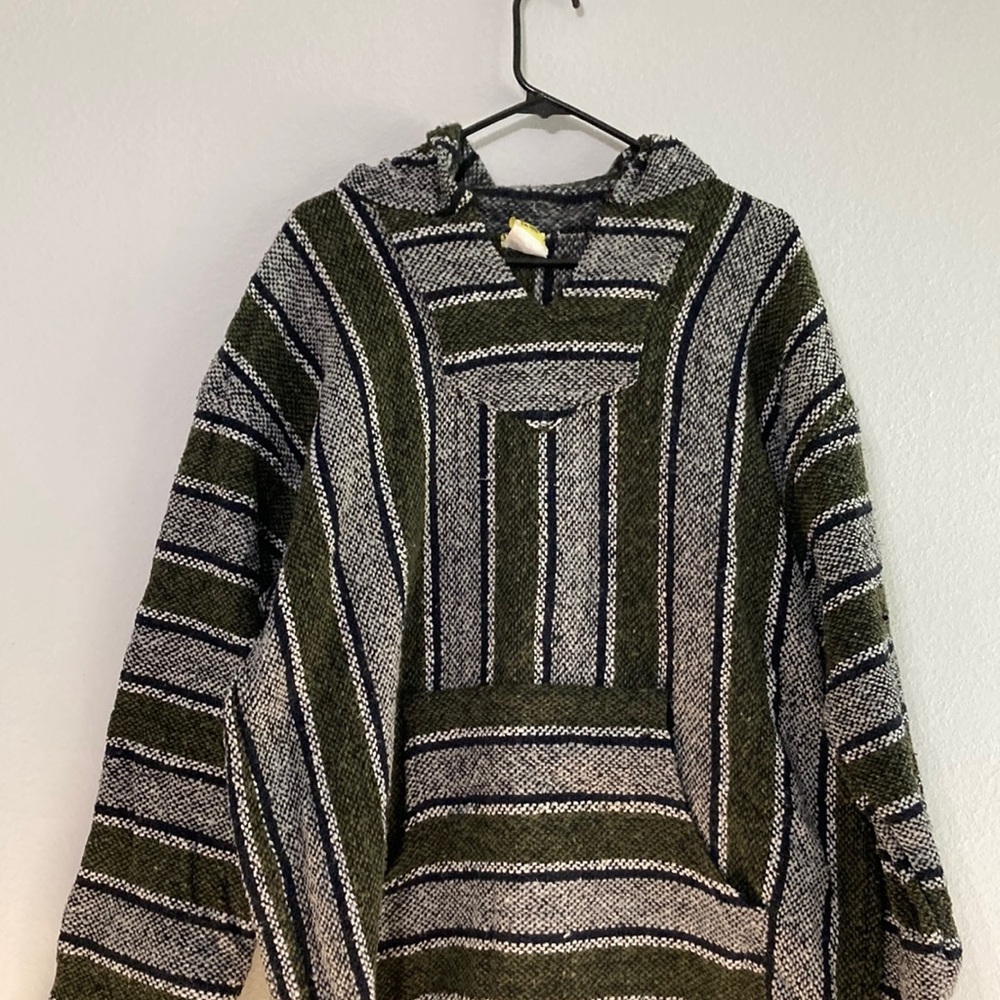 Black whit and green “drug rug”